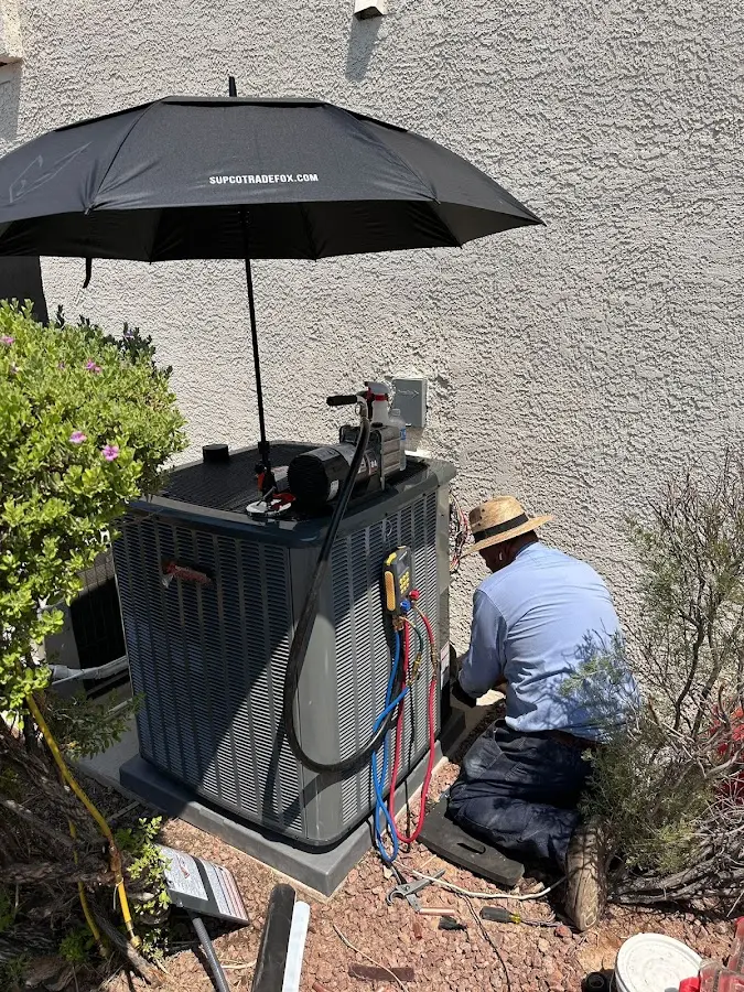 HVAC technician performing outdoor AC maintenance in Florham Park